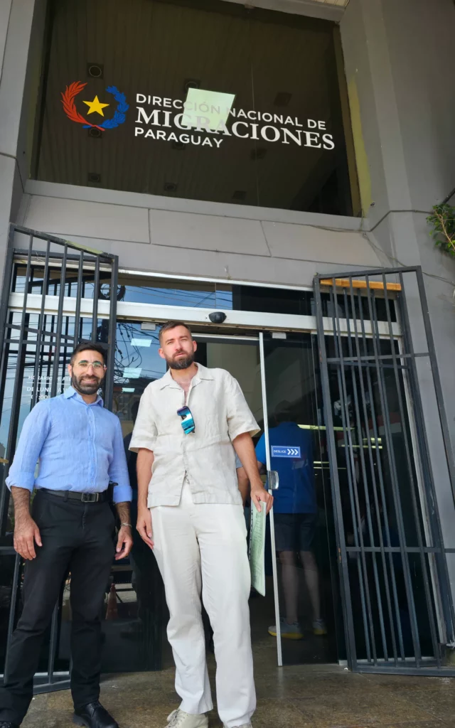 Osher with client after successful Paraguay residency process at Migraciones office in Asunción